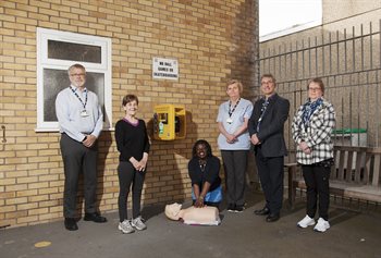 Cllr Eddie Wiliams and Rondel House staff with defibrillator